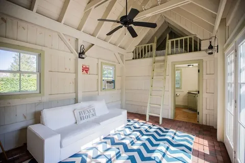 a bedroom with a bed and a couch