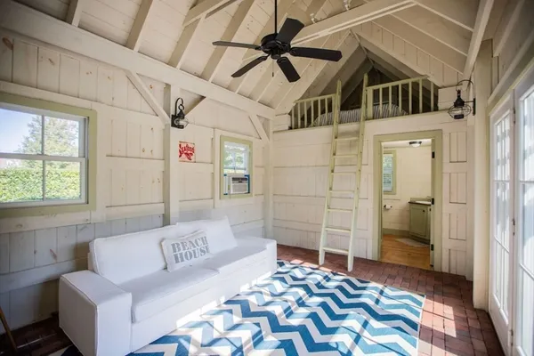 a bedroom with a bed and a couch