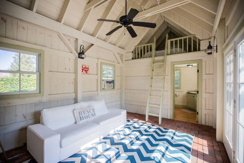 43 Vestal Street Nantucket, MA 02554 - Photo 19 of 19 a bedroom with a bed and a couch