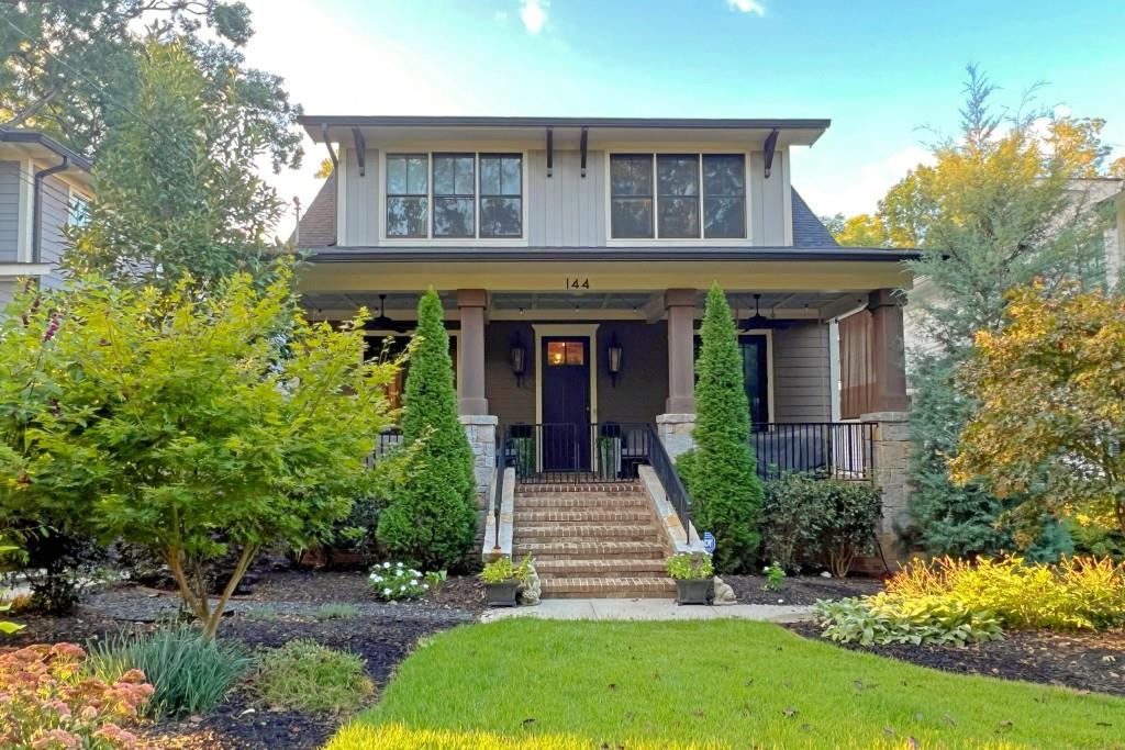 144 Maxwell Street Decatur, GA 30030 - Photo 1 of 1 a view of a house with brick walls and flower plants