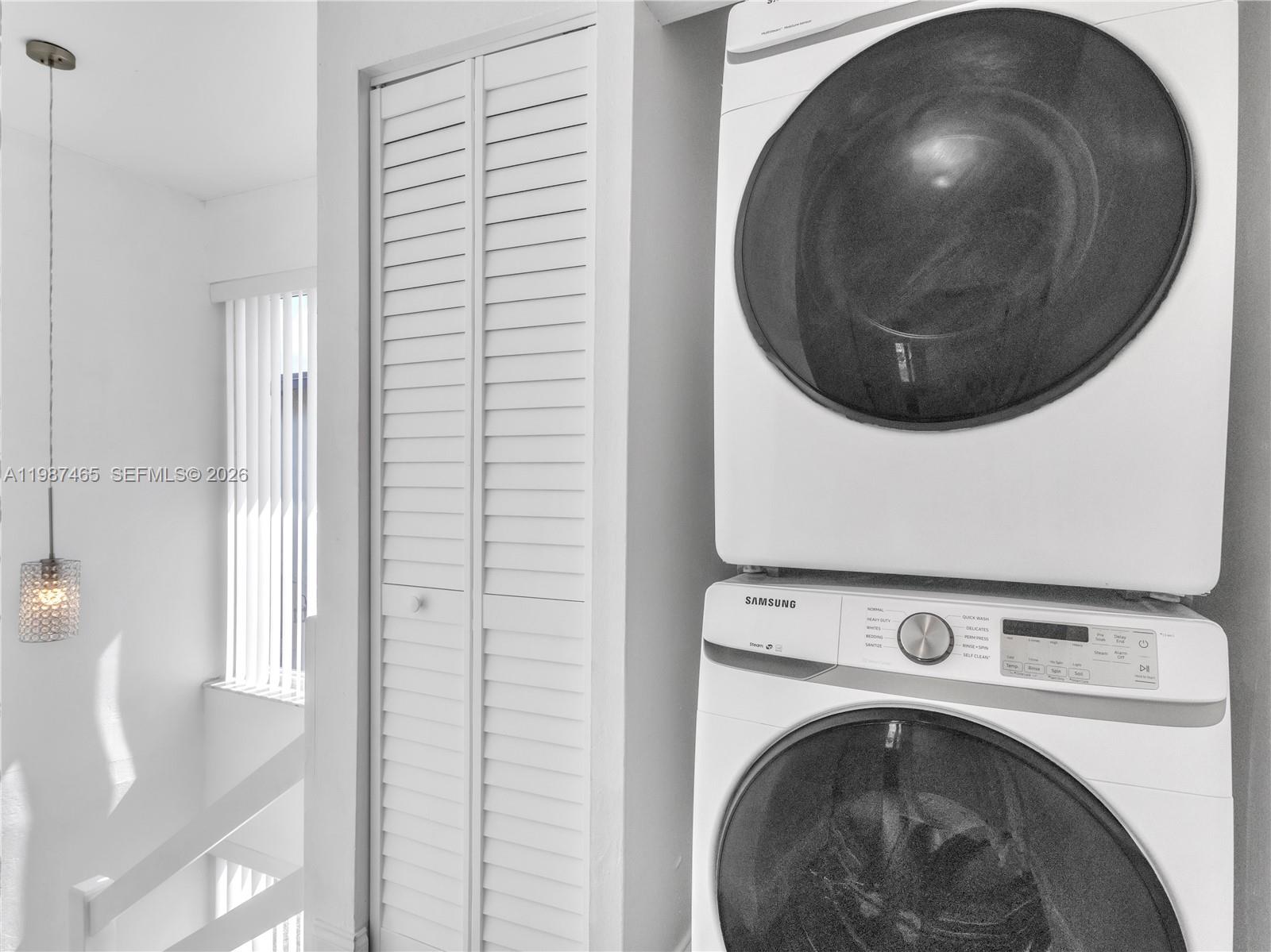 6505 Southwest 113th Place Miami, FL 33173 - Photo 12 of 25 a room with a washer and dryer