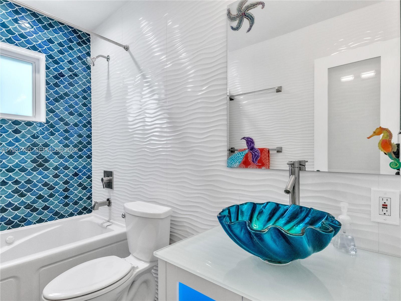 6505 Southwest 113th Place Miami, FL 33173 - Photo 13 of 25 a bathroom with a sink toilet and shower