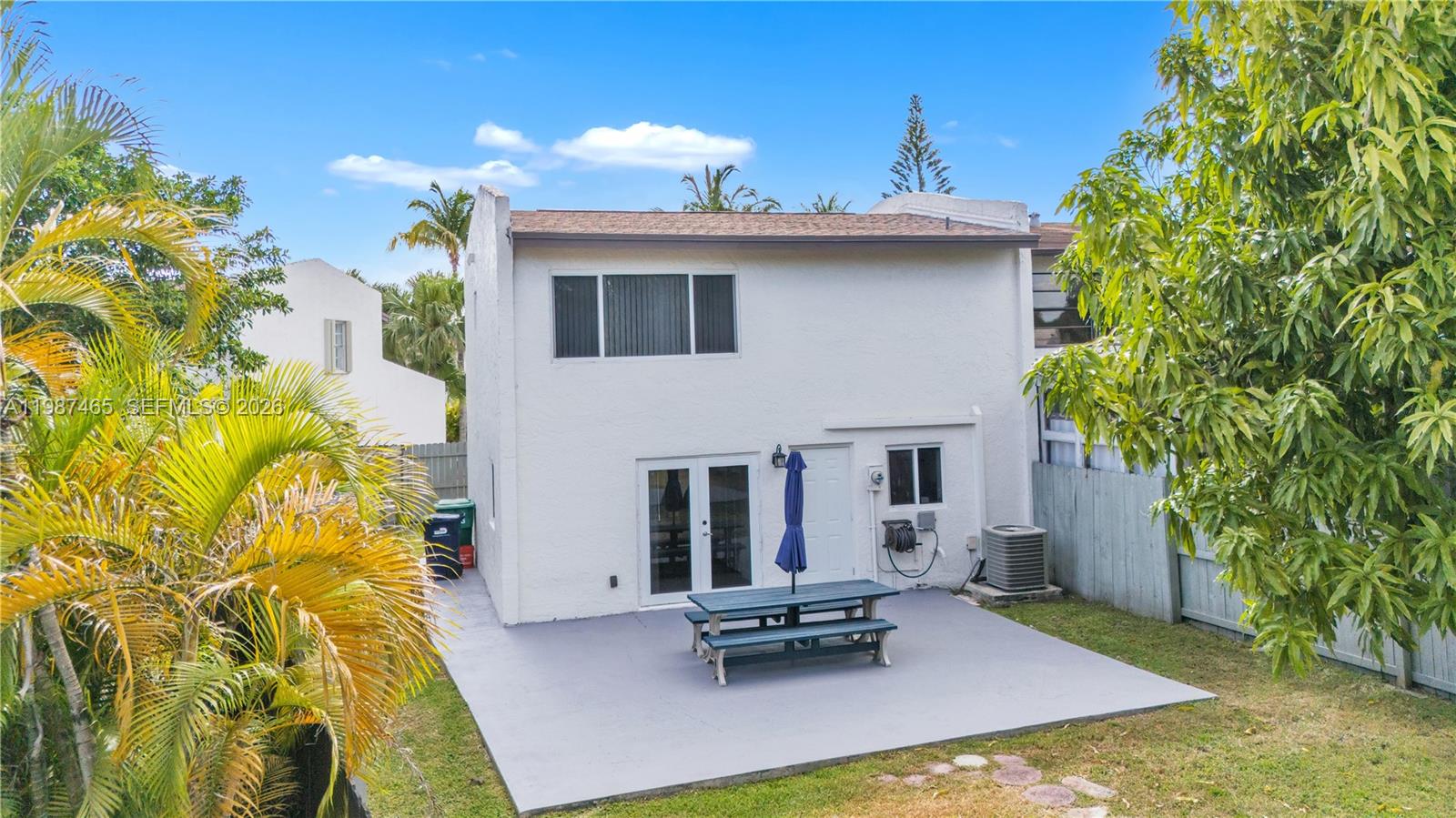 6505 Southwest 113th Place Miami, FL 33173 - Photo 20 of 25 a view of a dinning table and chairs in patio