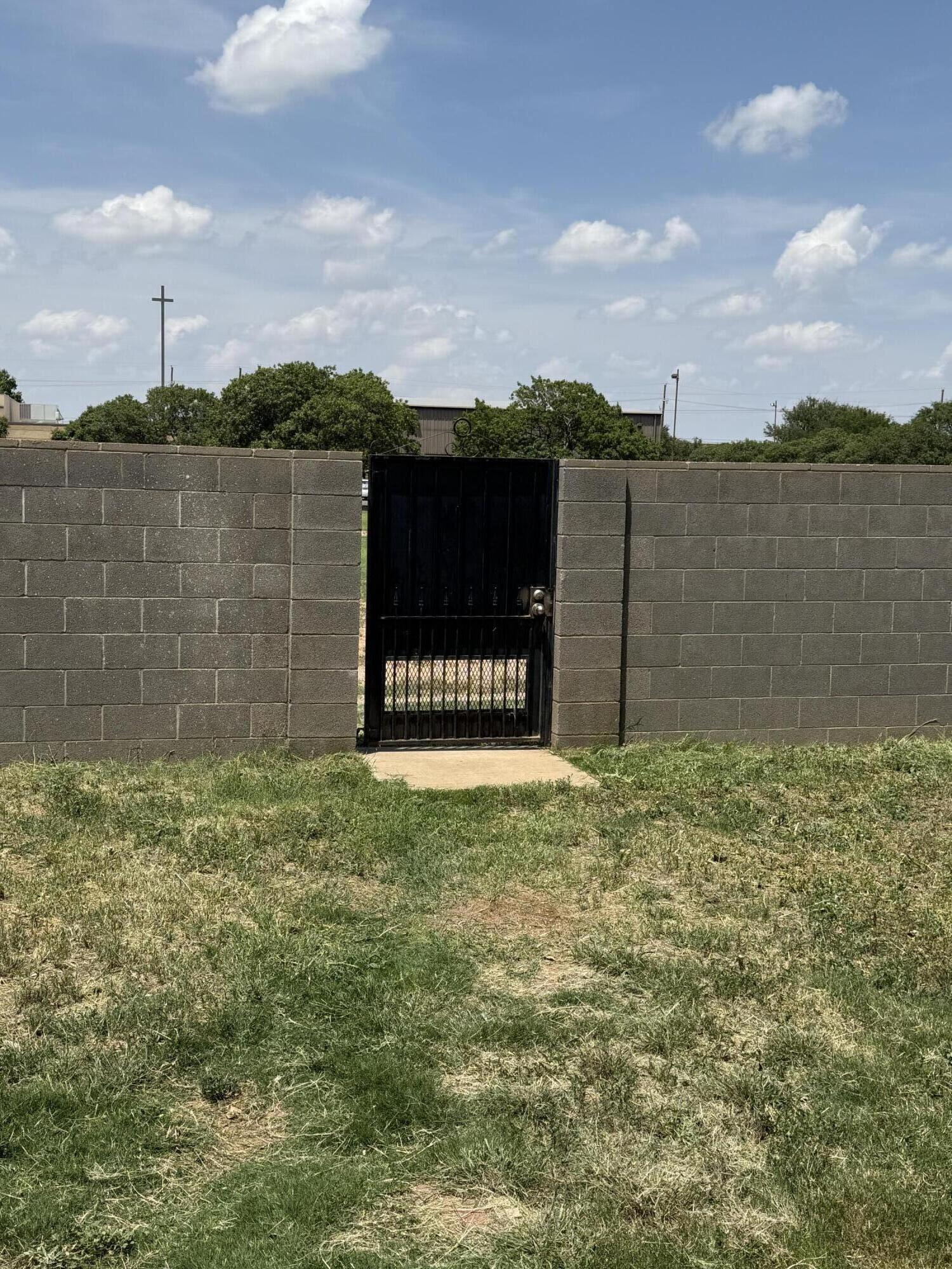 6004 68th Street Lubbock, TX 79424 - Photo 17 of 17 a view of a lake with a building in the background
