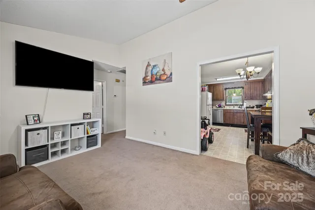 a view of livingroom with furniture and flat screen tv