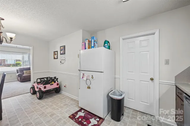 a bedroom with a couch and a potted plant