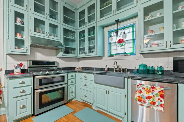 a dining room with furniture and wooden floor