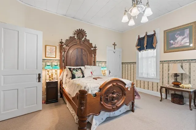 a bedroom with a bed and furniture