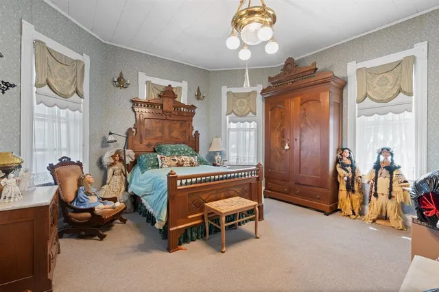 a bedroom with furniture and a bed