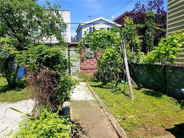 a view of a garden with a bench