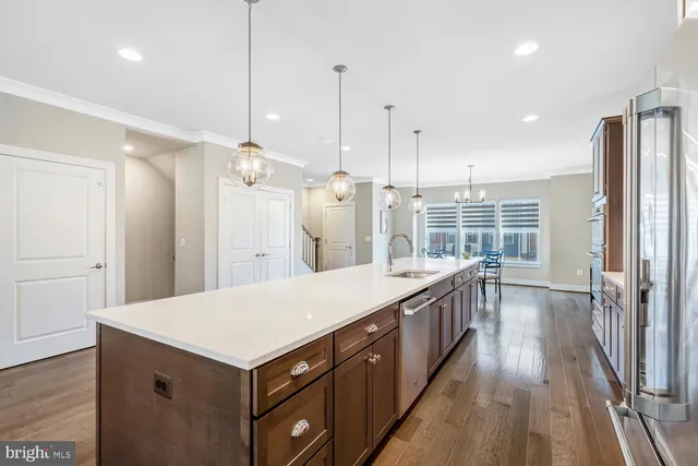 a bedroom with a large bed and a ceiling fan