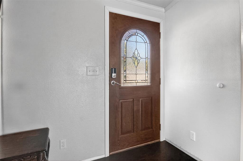 166 Quiten Lane Graham, TX 76450 - Photo 13 of 40 a view of a livingroom with wooden floor and a window