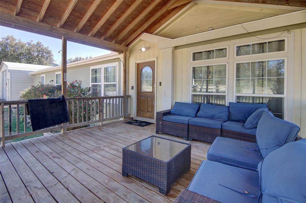 166 Quiten Lane Graham, TX 76450 - Photo 16 of 40 a living room with furniture a wooden floor and garden view