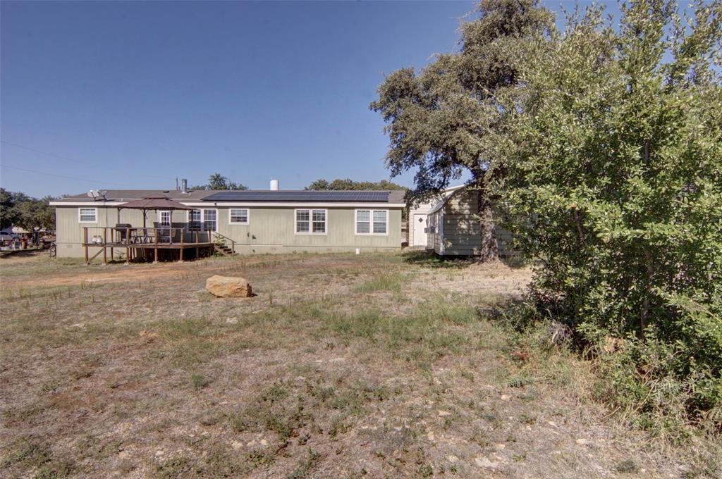 166 Quiten Lane Graham, TX 76450 - Photo 2 of 40 a view of residential houses with yard and car parked