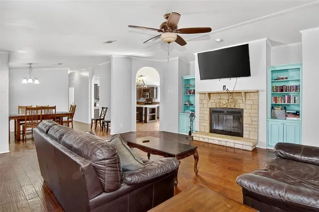 a living room with furniture fireplace and flat screen tv