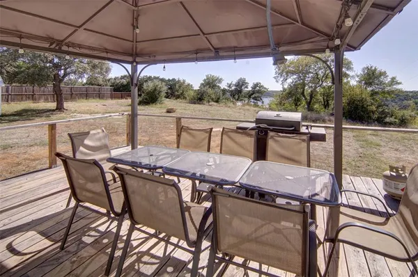 a patio with a patio table and chairs