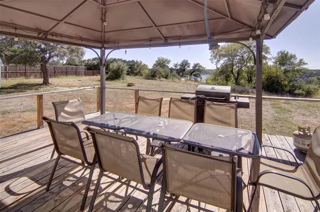 a patio with a patio table and chairs