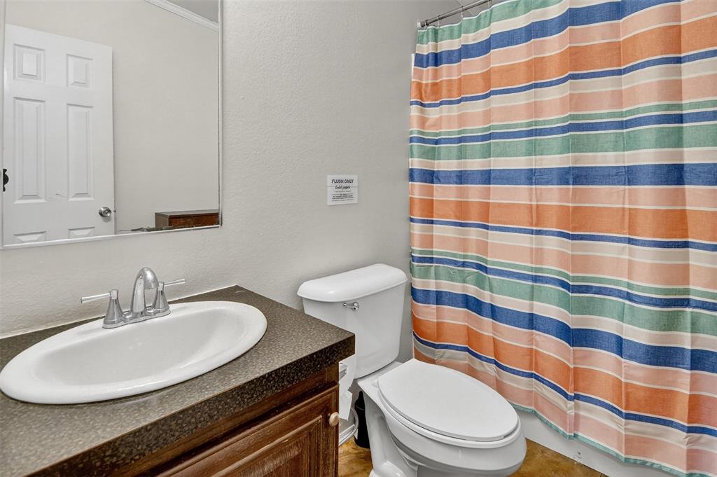 166 Quiten Lane Graham, TX 76450 - Photo 3 of 40 a bathroom with a sink toilet and shower