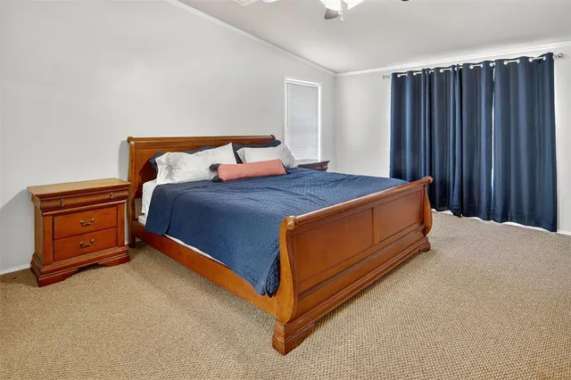 a bed sitting in a room with furniture