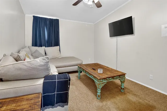 a living room with a couch and a flat screen tv