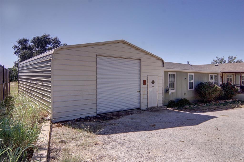 166 Quiten Lane Graham, TX 76450 - Photo 36 of 40 a view of a house with a yard