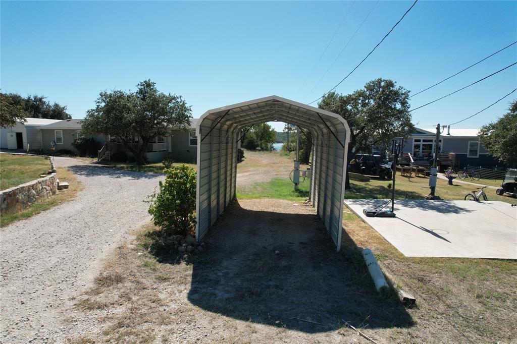 166 Quiten Lane Graham, TX 76450 - Photo 39 of 40 a view of a swimming pool with a patio
