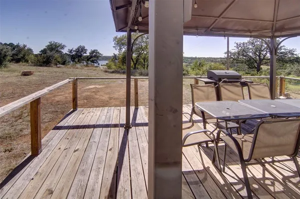 a balcony view with a seating space
