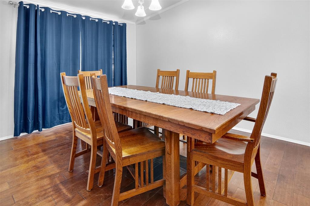 166 Quiten Lane Graham, TX 76450 - Photo 10 of 40 a view of a dining room with furniture and wooden floor