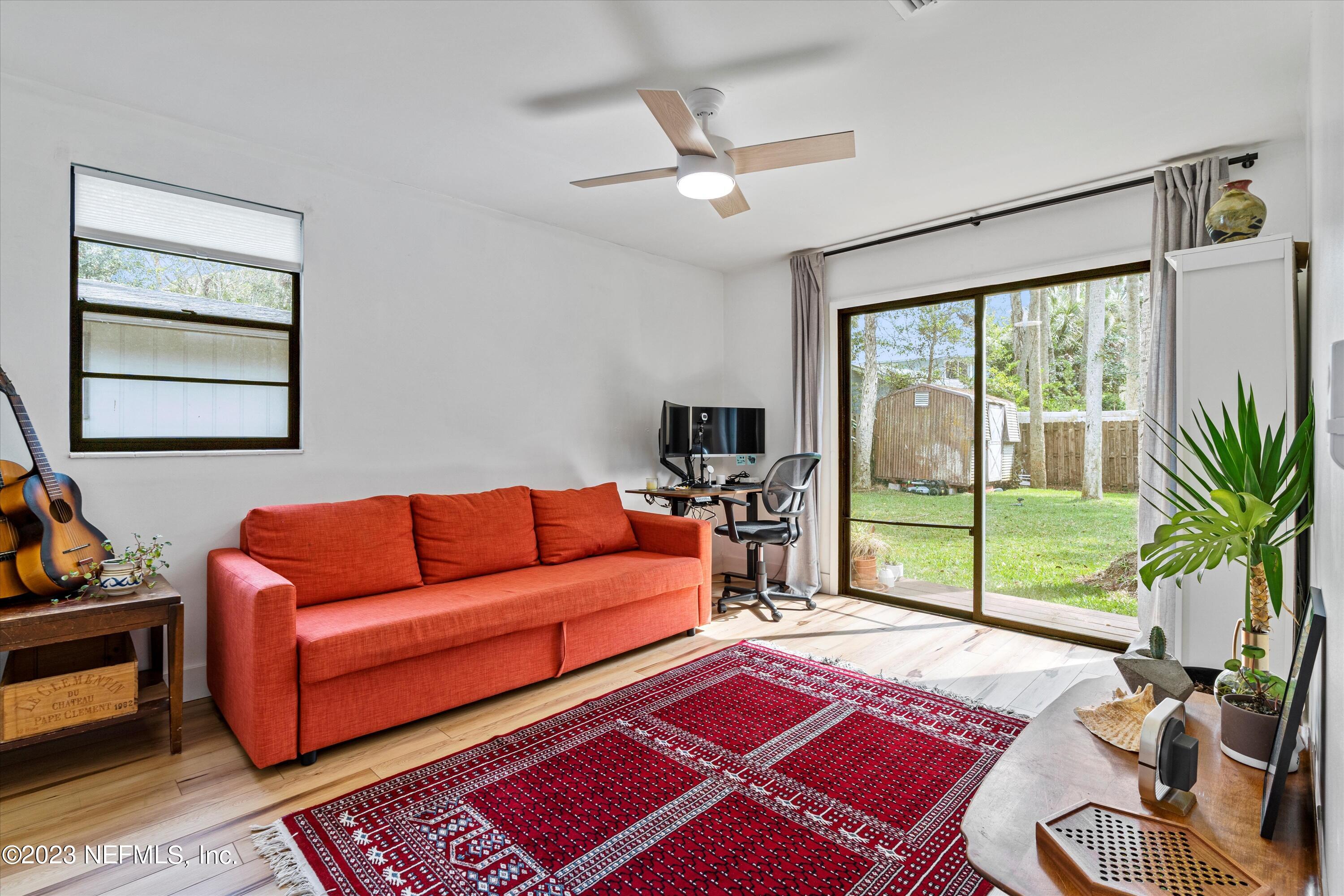 376 9th Street Atlantic Beach, FL 32233 - Photo 15 of 27 a living room with furniture and a floor to ceiling window