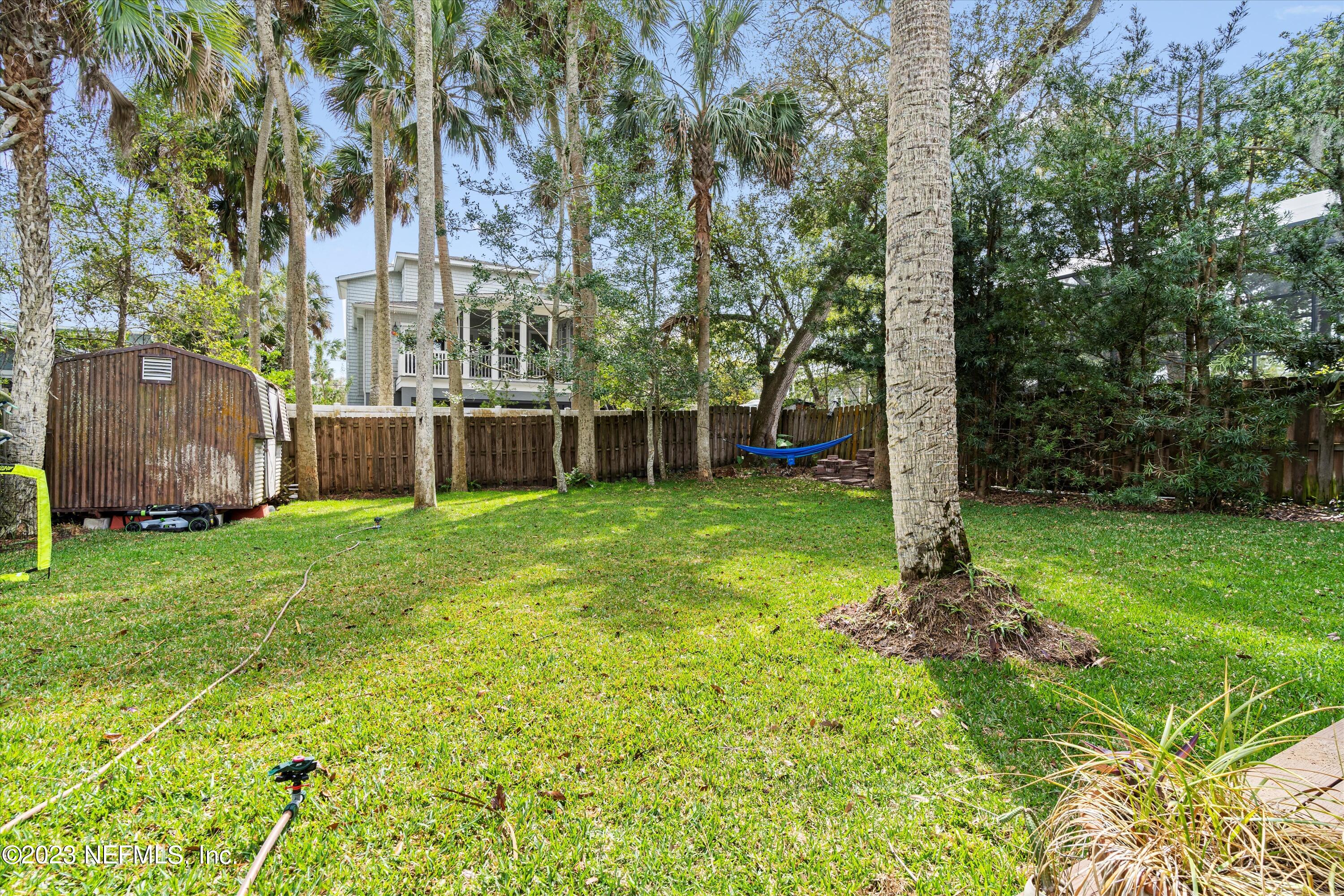 376 9th Street Atlantic Beach, FL 32233 - Photo 23 of 27 a view of a house with backyard and a tree