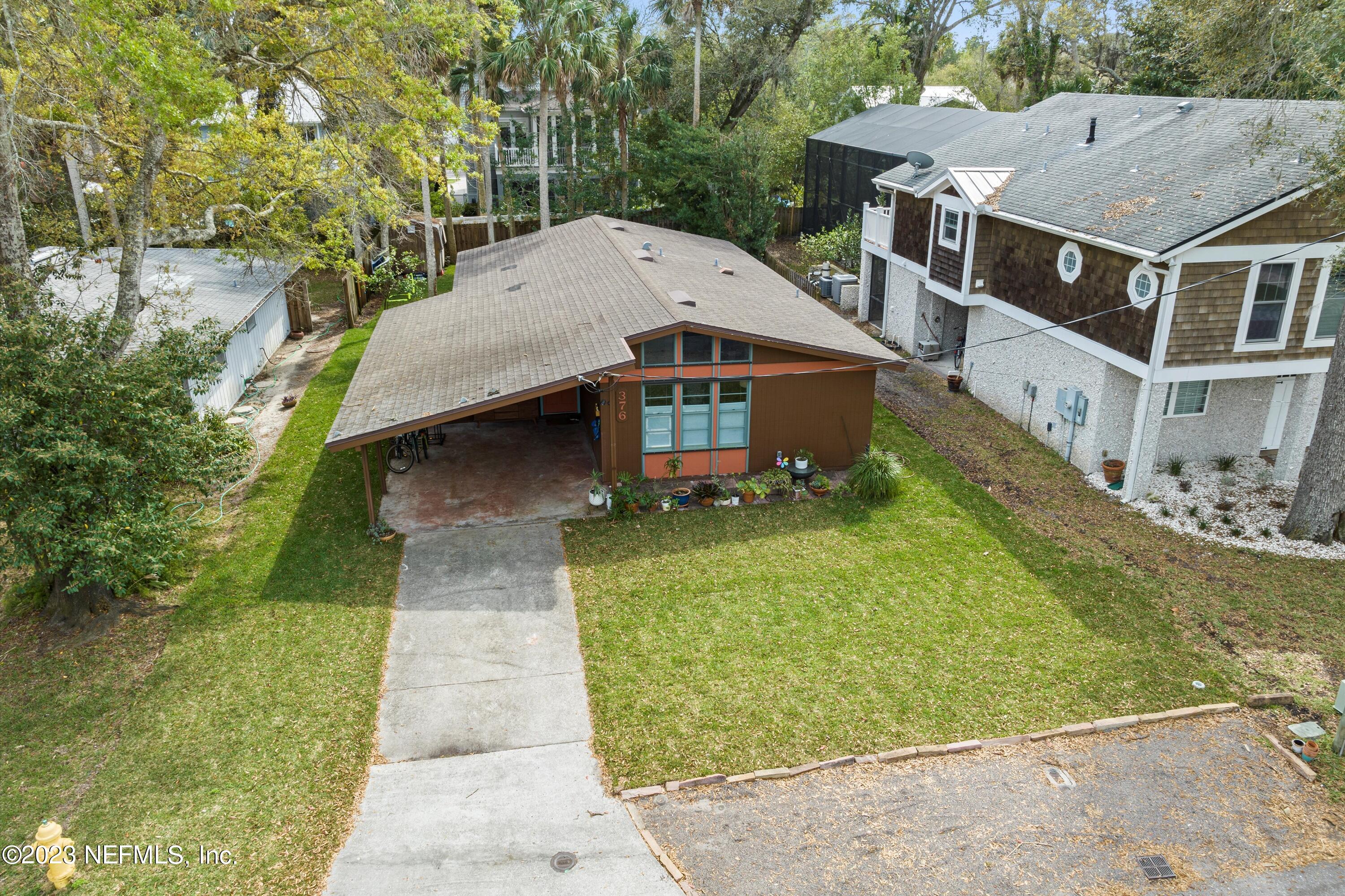 376 9th Street Atlantic Beach, FL 32233 - Photo 3 of 27 an aerial view of a house with a yard