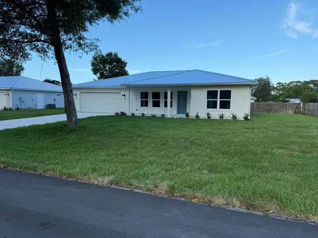 a house view with a garden space