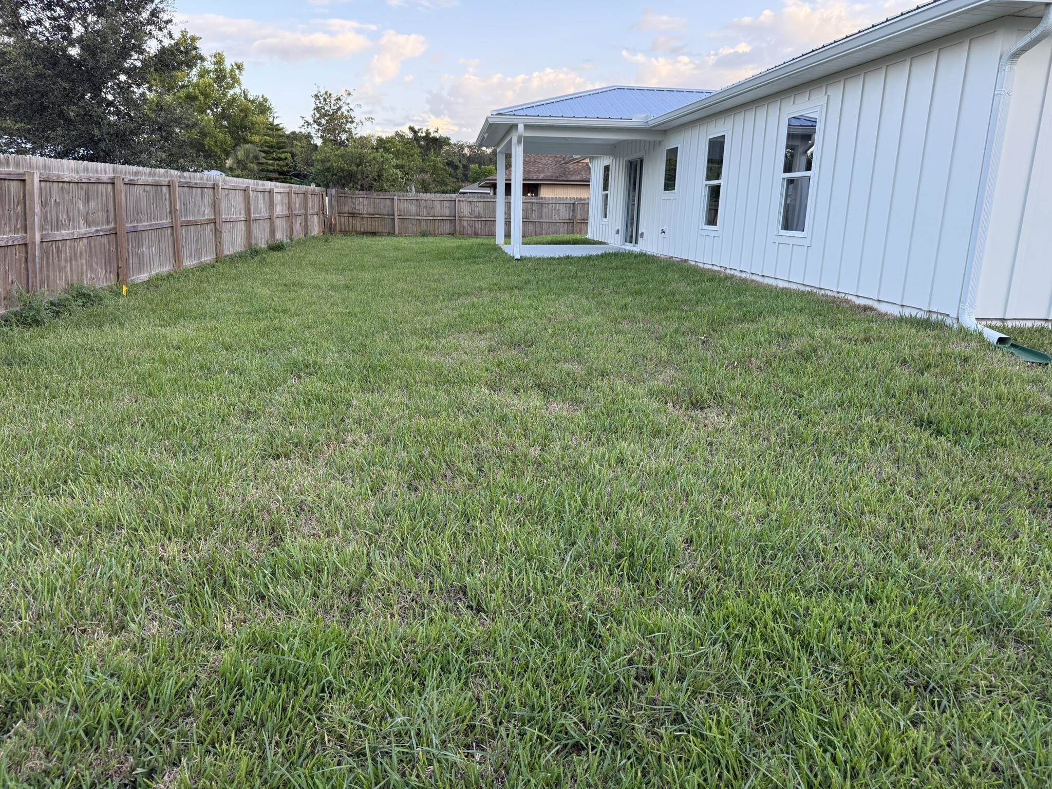 107 Lobelia Road St. Augustine, FL 32086 - Photo 15 of 15 a view of a house with backyard and porch