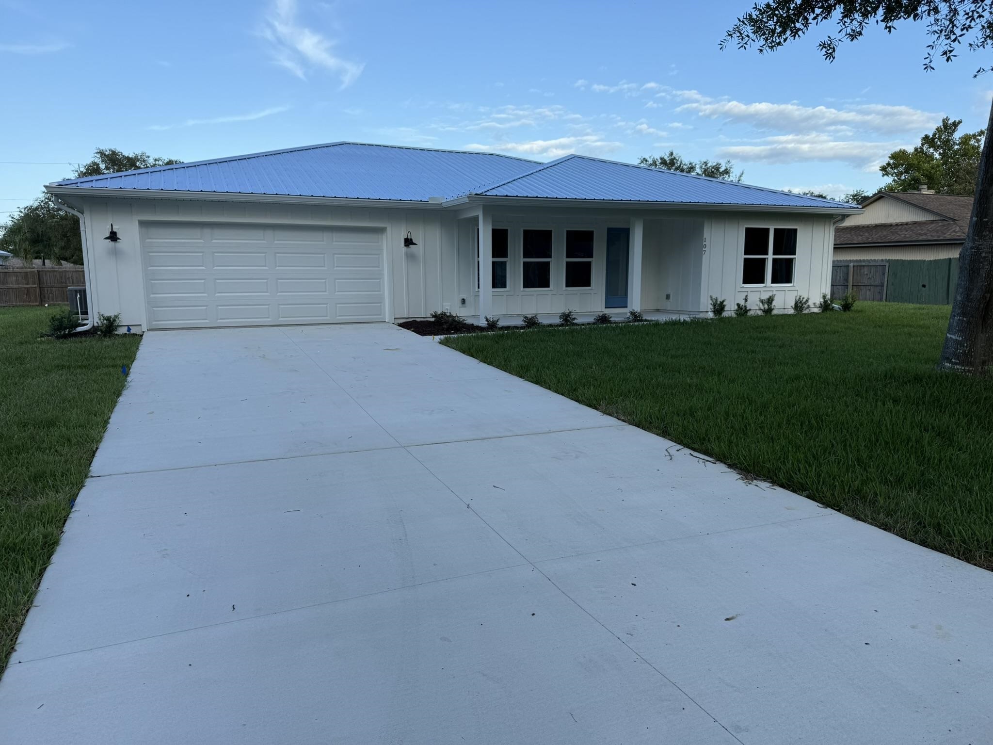 107 Lobelia Road St. Augustine, FL 32086 - Photo 2 of 15 a front view of house with yard