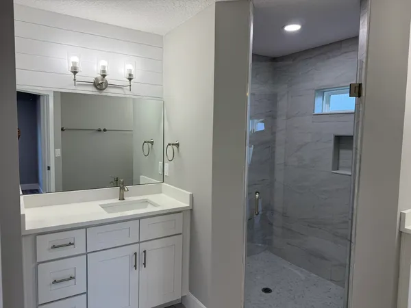 a bathroom with a sink and a mirror