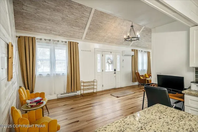 a bedroom with furniture and a window