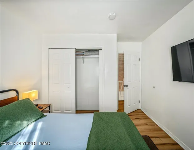 a bedroom with a bed and a table in it