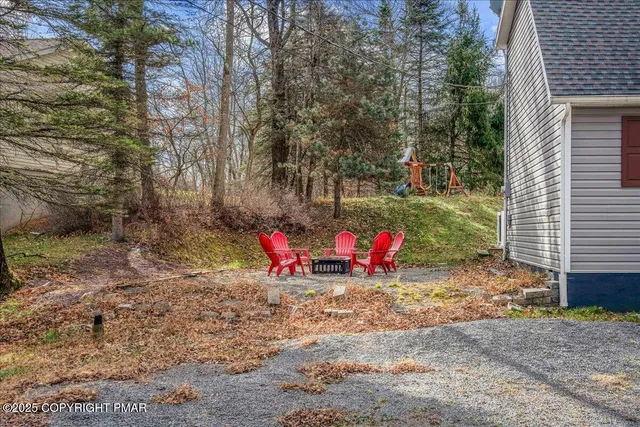 a view of a backyard with a tree