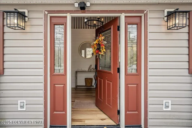 a view of a house with a door and balcony