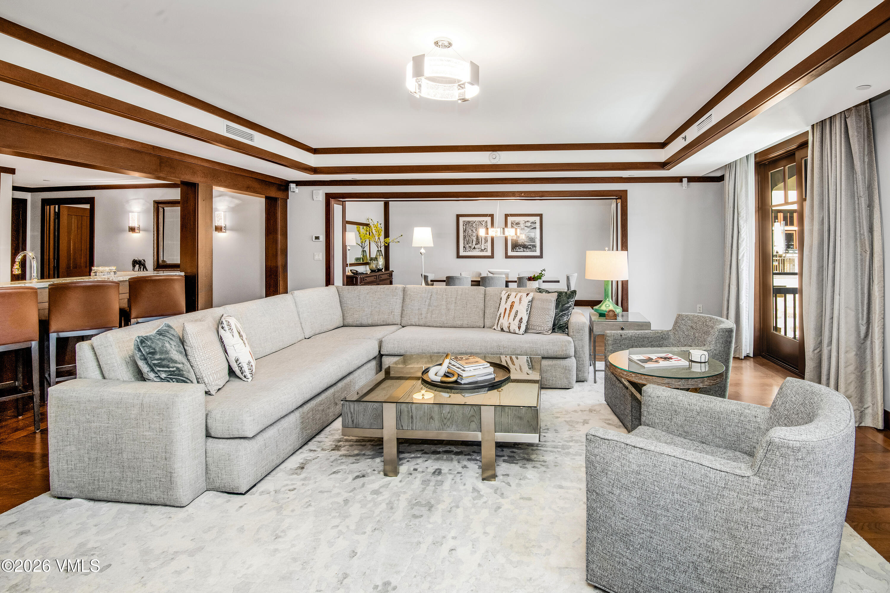 1 Vail Road, Unit 5102C Vail, CO 81657 - Photo 2 of 13 a living room with furniture and a large window