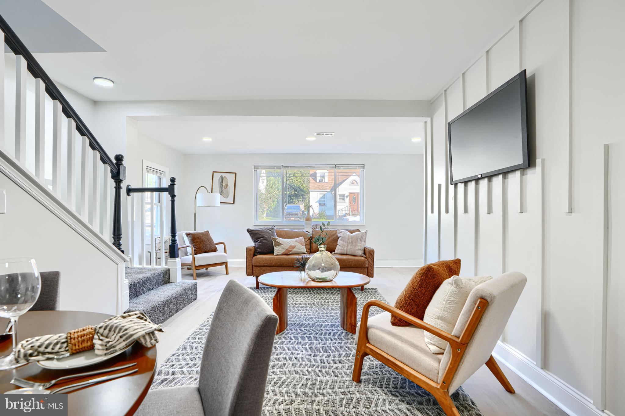 212 North Marlyn Avenue Essex, MD 21221 - Photo 11 of 54 a living room with furniture and a potted plant