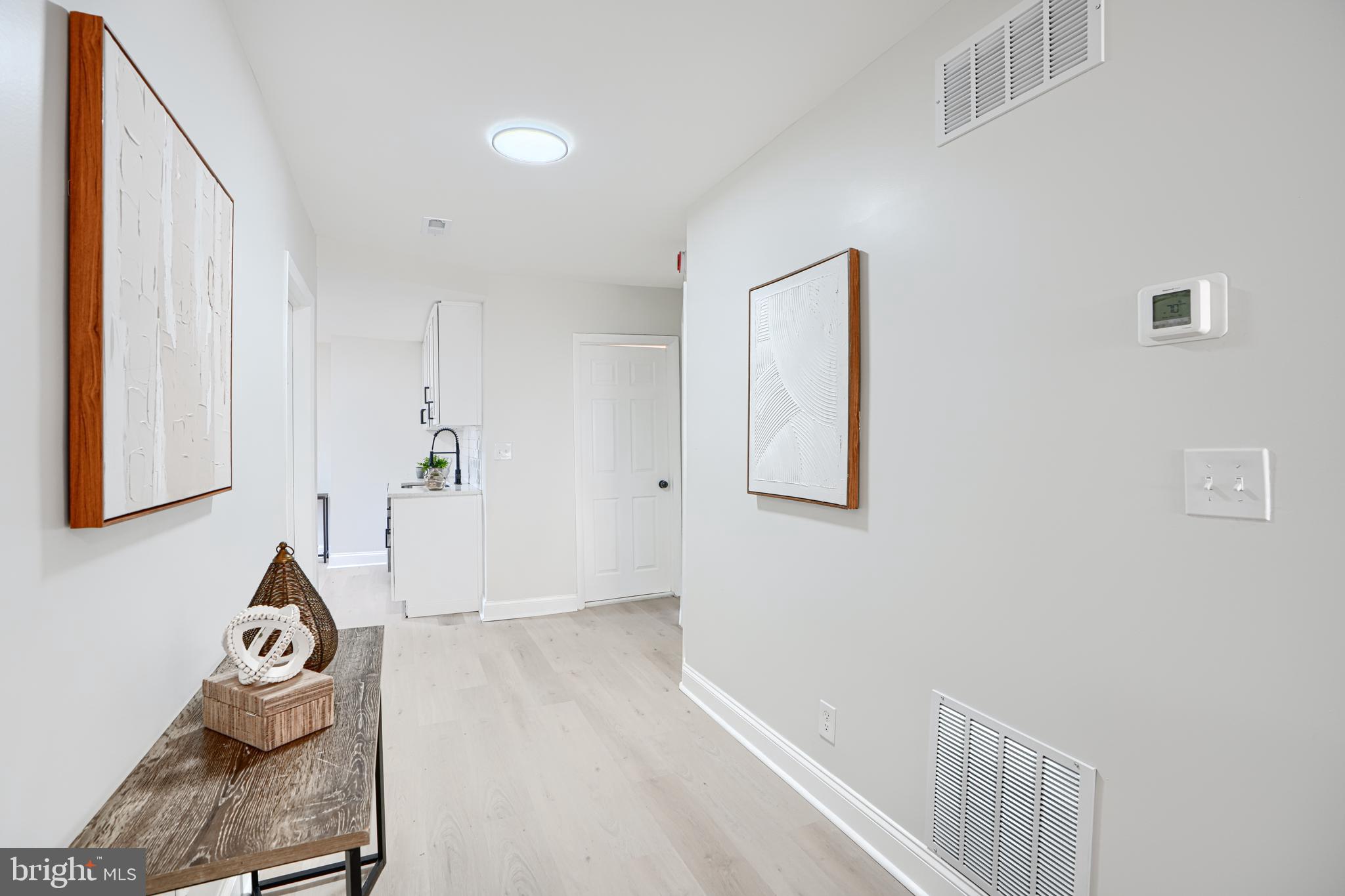 212 North Marlyn Avenue Essex, MD 21221 - Photo 12 of 54 a view of room with wooden floor