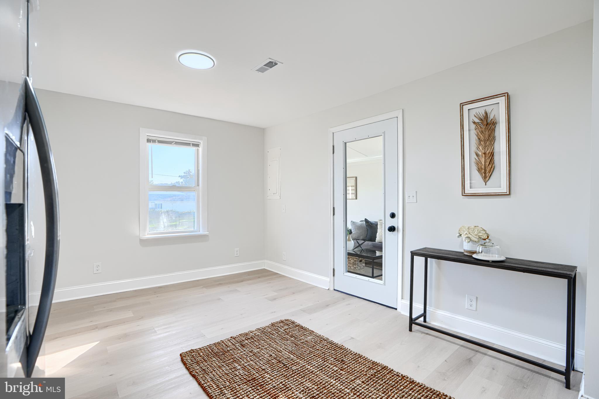 212 North Marlyn Avenue Essex, MD 21221 - Photo 15 of 54 a living room with a baby crib furniture and a window