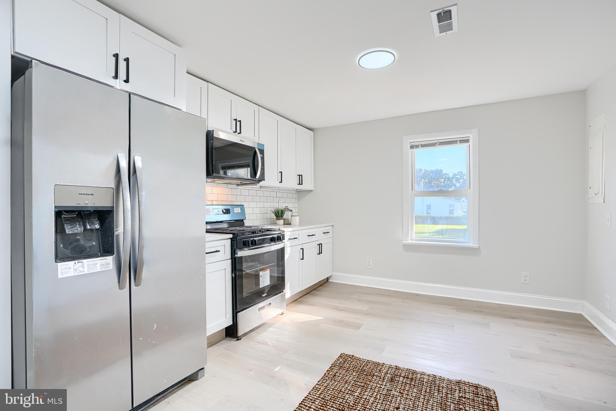 212 North Marlyn Avenue Essex, MD 21221 - Photo 17 of 54 a kitchen with stainless steel appliances granite countertop a refrigerator a stove and a sink