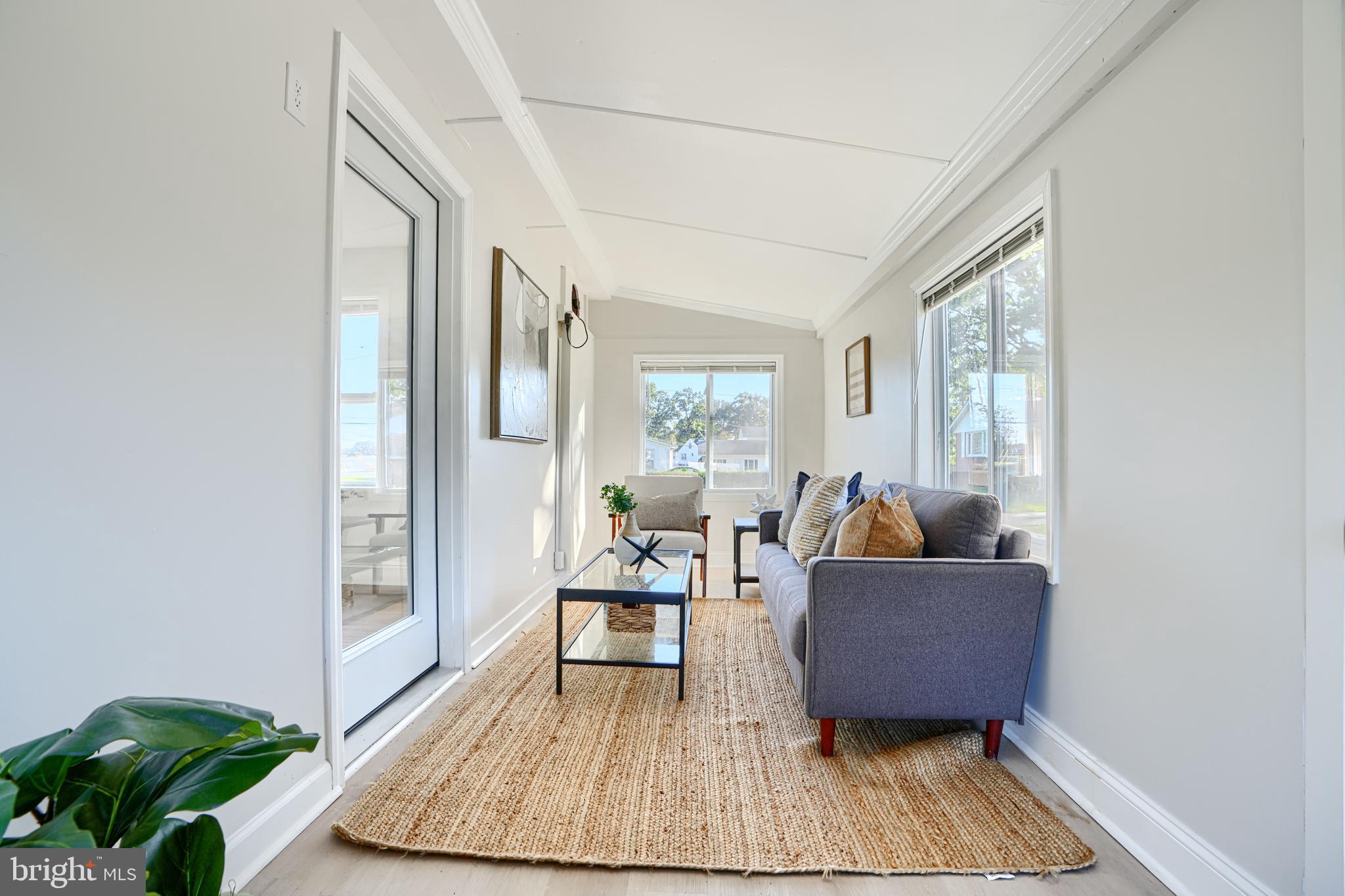 212 North Marlyn Avenue Essex, MD 21221 - Photo 24 of 54 a living room with furniture rug and wooden floor