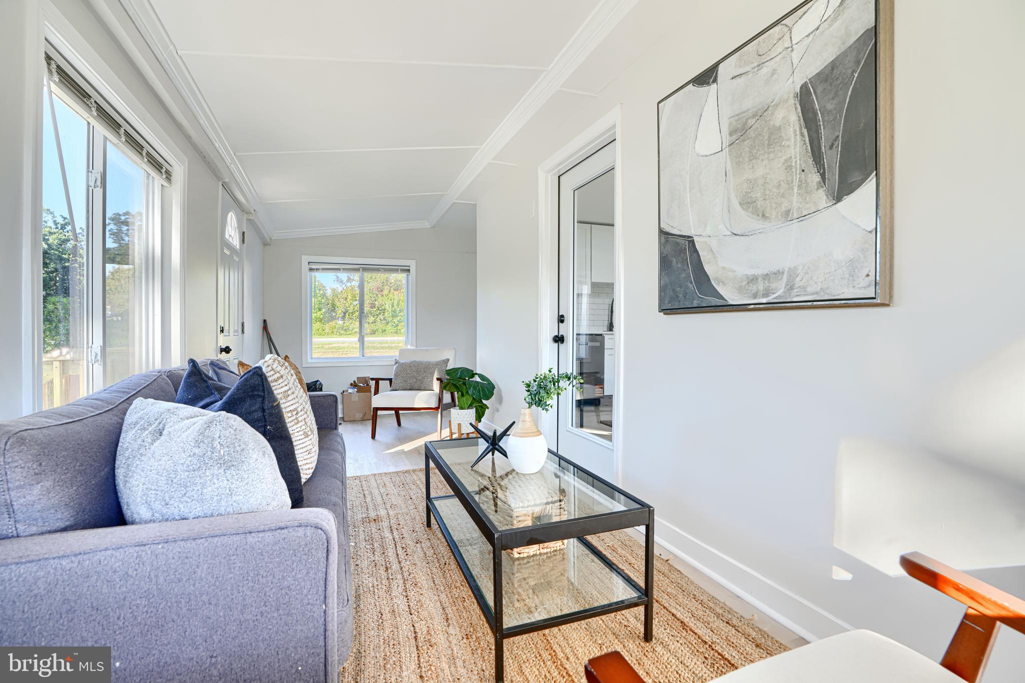 212 North Marlyn Avenue Essex, MD 21221 - Photo 25 of 54 a living room with furniture and a painting on the wall