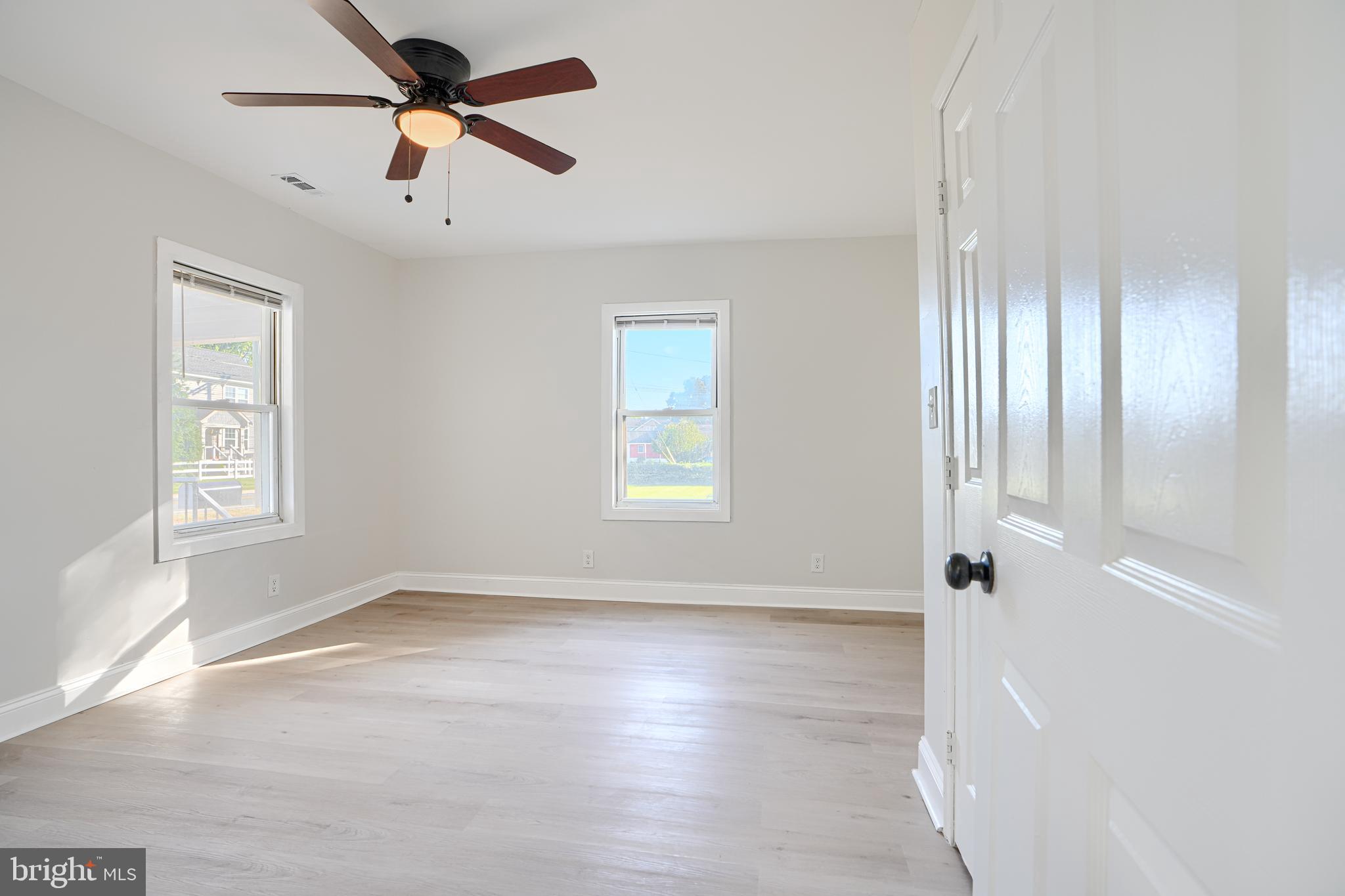 212 North Marlyn Avenue Essex, MD 21221 - Photo 29 of 54 wooden floor in an empty room with a window