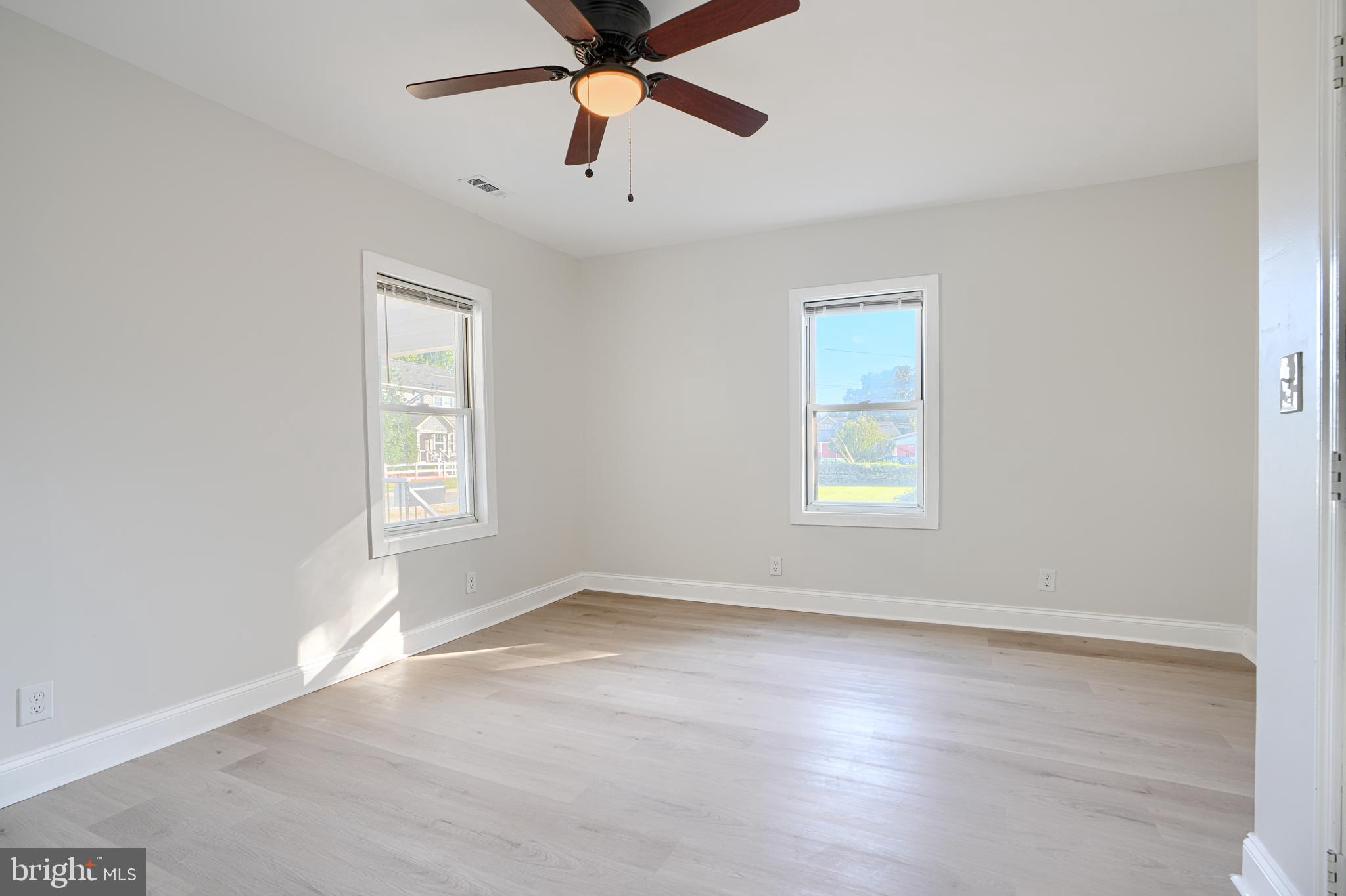 212 North Marlyn Avenue Essex, MD 21221 - Photo 36 of 54 an empty room with windows and fan