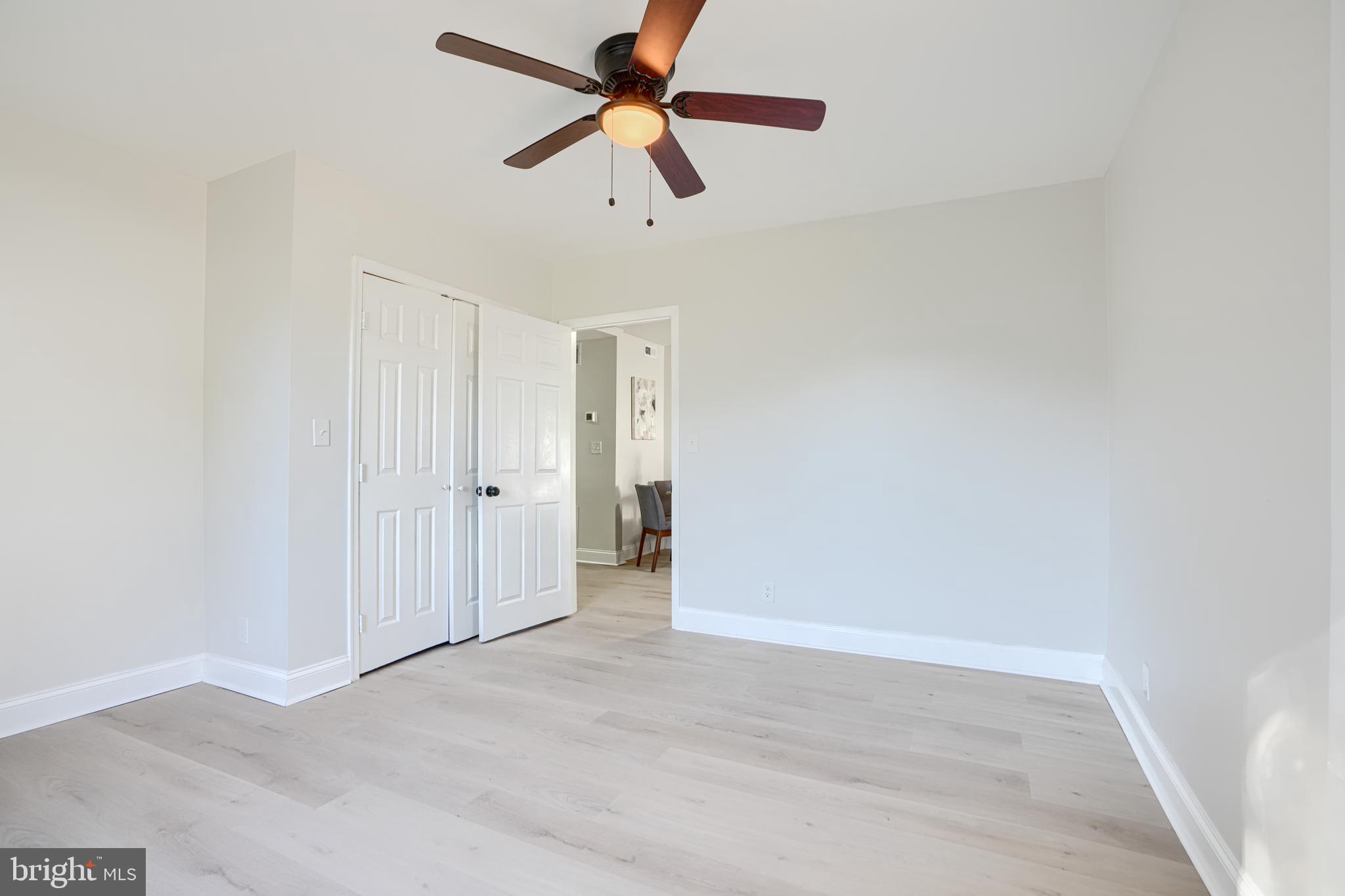 212 North Marlyn Avenue Essex, MD 21221 - Photo 37 of 54 an empty room with closet and a ceiling fan