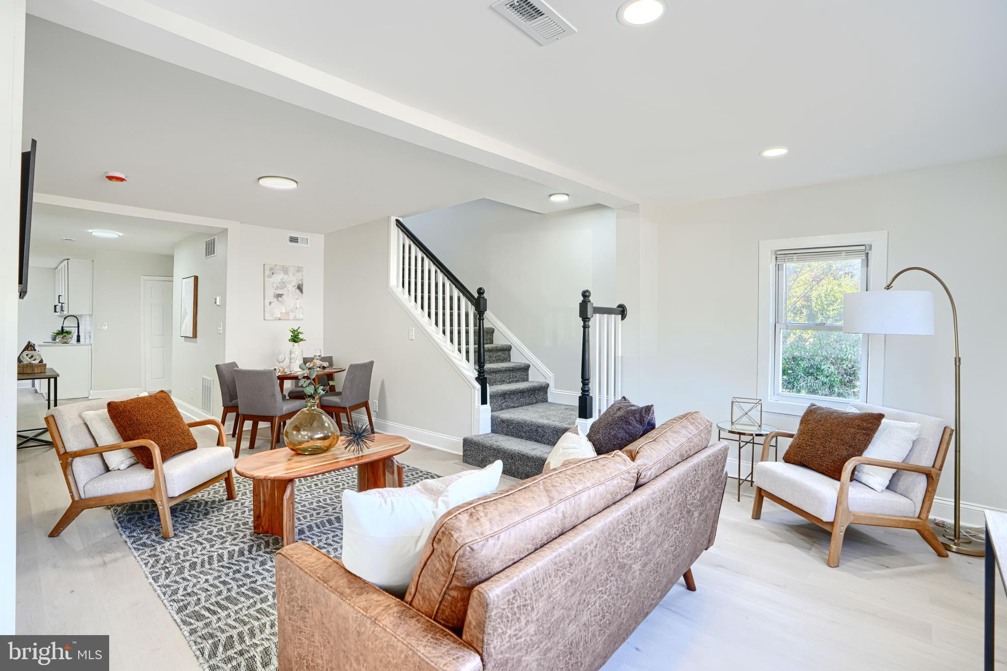212 North Marlyn Avenue Essex, MD 21221 - Photo 4 of 54 a living room with furniture and a potted plant